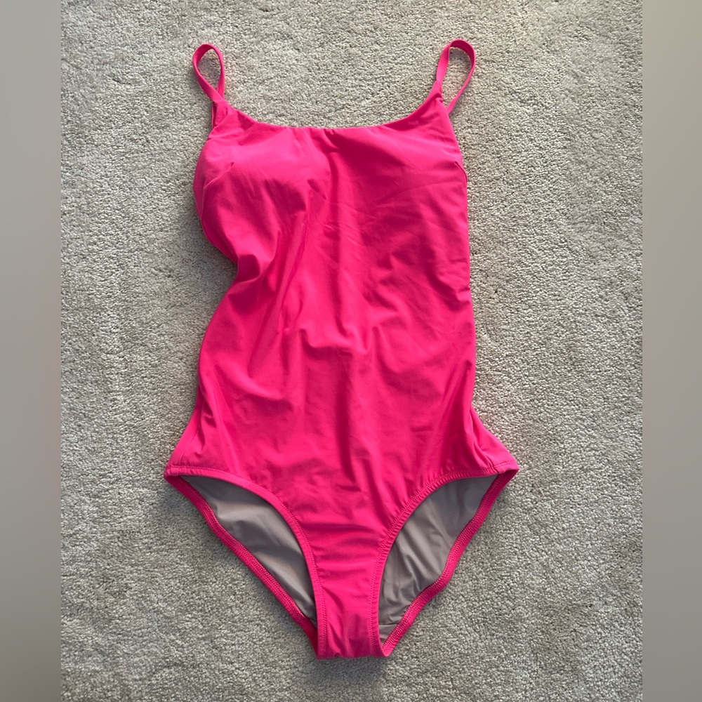 Pink Lululemon one piece swimsuit with cross cross back. Never worn!